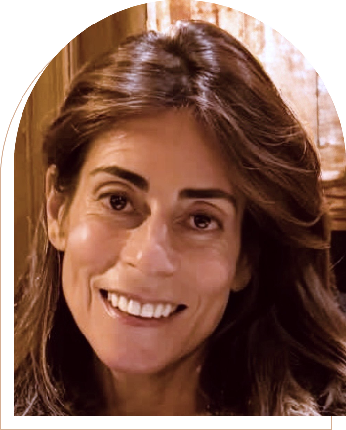Portrait of Daniella Gilbertson, smiling, with long dark hair